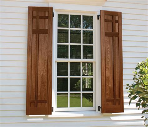 tan siding oak shutters.